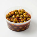 Chamoy green olives coated in sweet, sour, and spicy chamoy with chili powder for a bold Mexican snack flavor, made fresh in Cibolo and serving San Antonio, TX