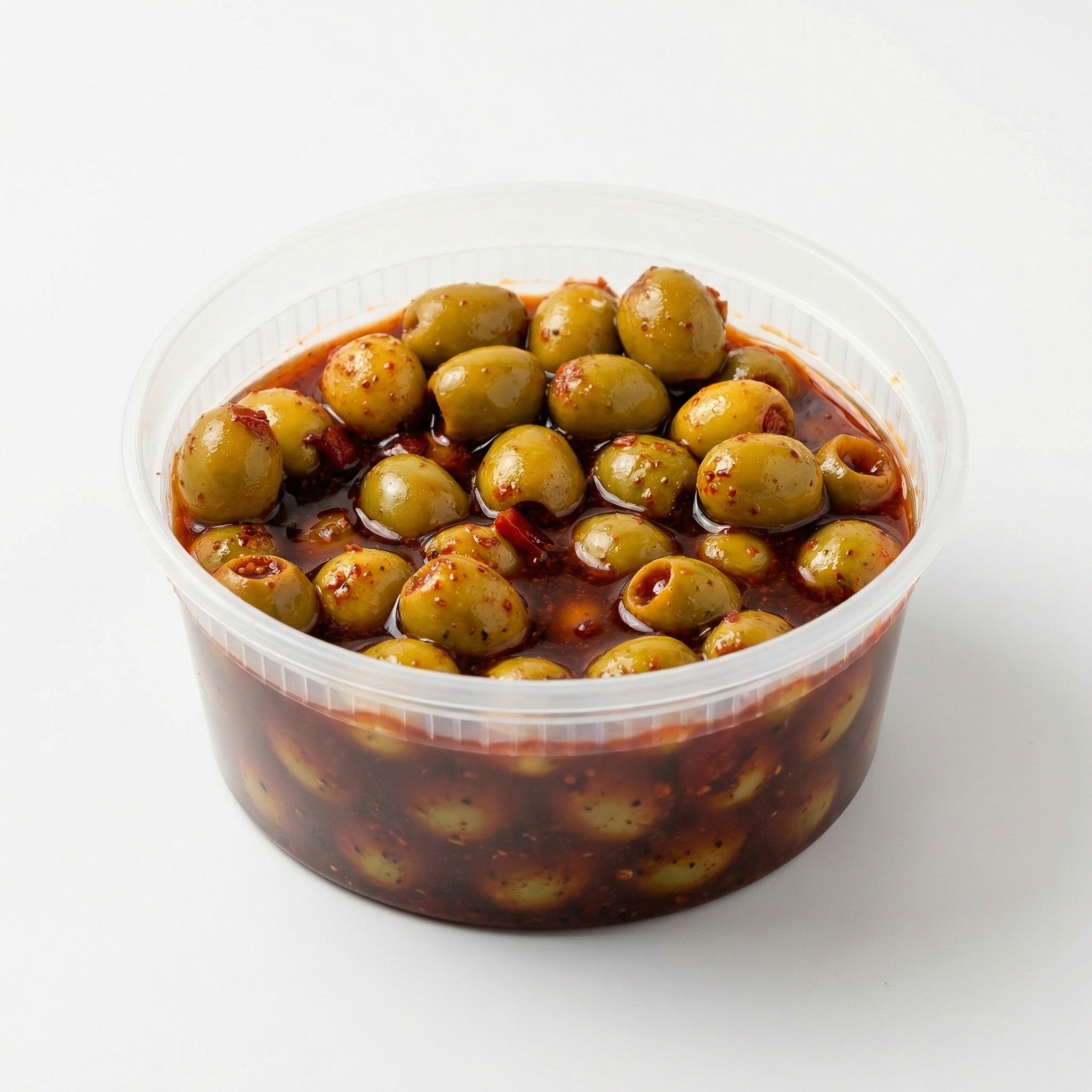 Chamoy green olives coated in sweet, sour, and spicy chamoy with chili powder for a bold Mexican snack flavor, made fresh in Cibolo and serving San Antonio, TX
